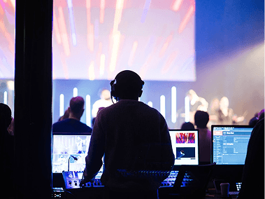 Sound engineer operating during performance
